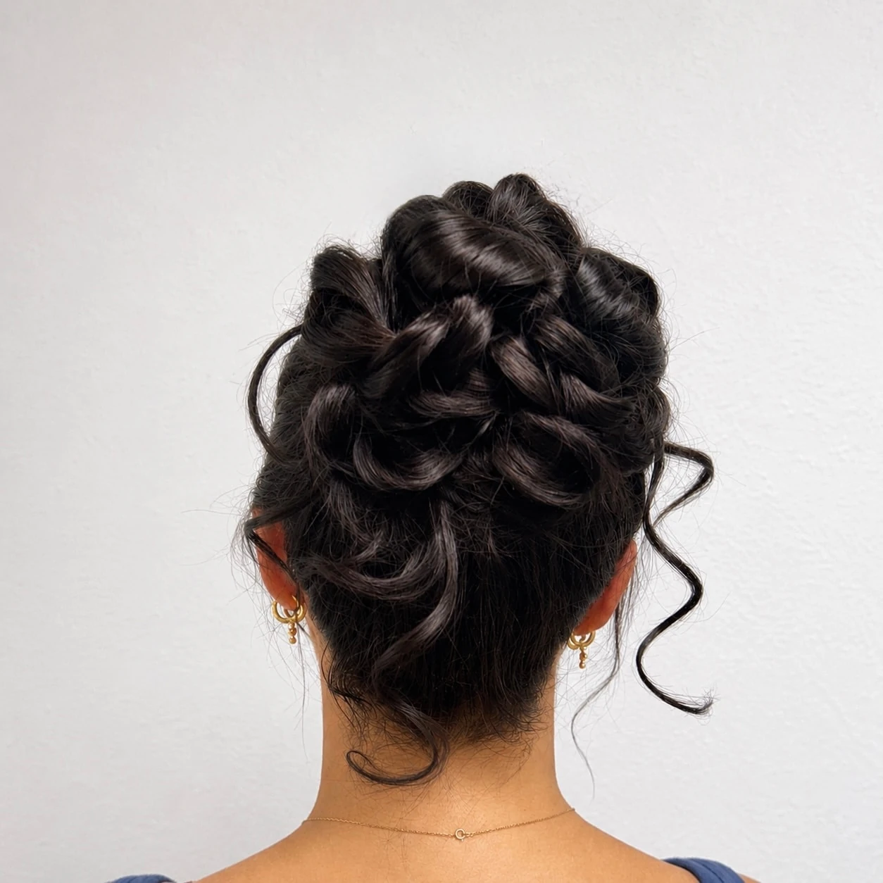 A braided bun updo, back view