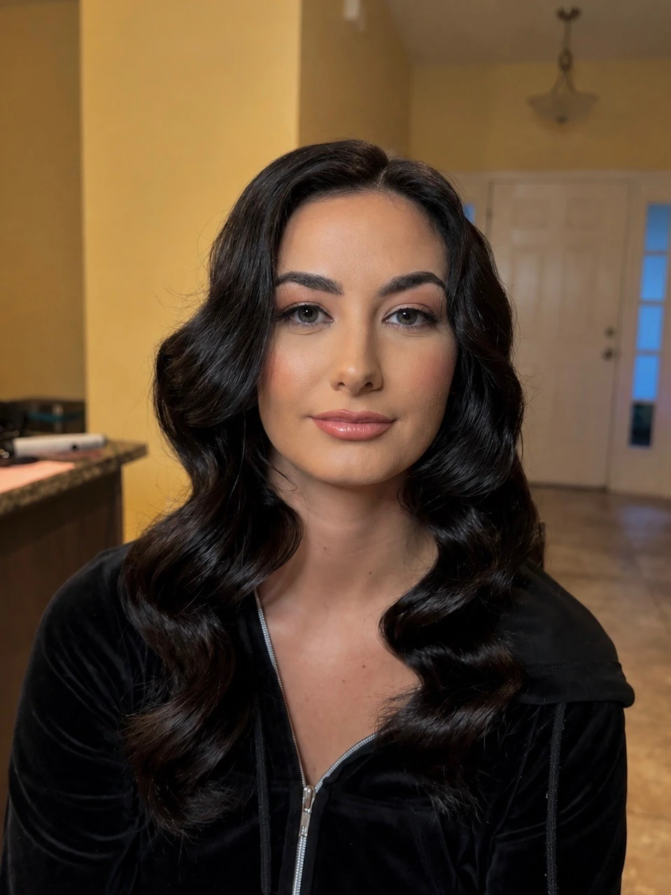 Soft glam makeup with old-Hollywood waves
